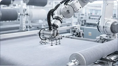 Robotic arm handling textile rolls on a production line